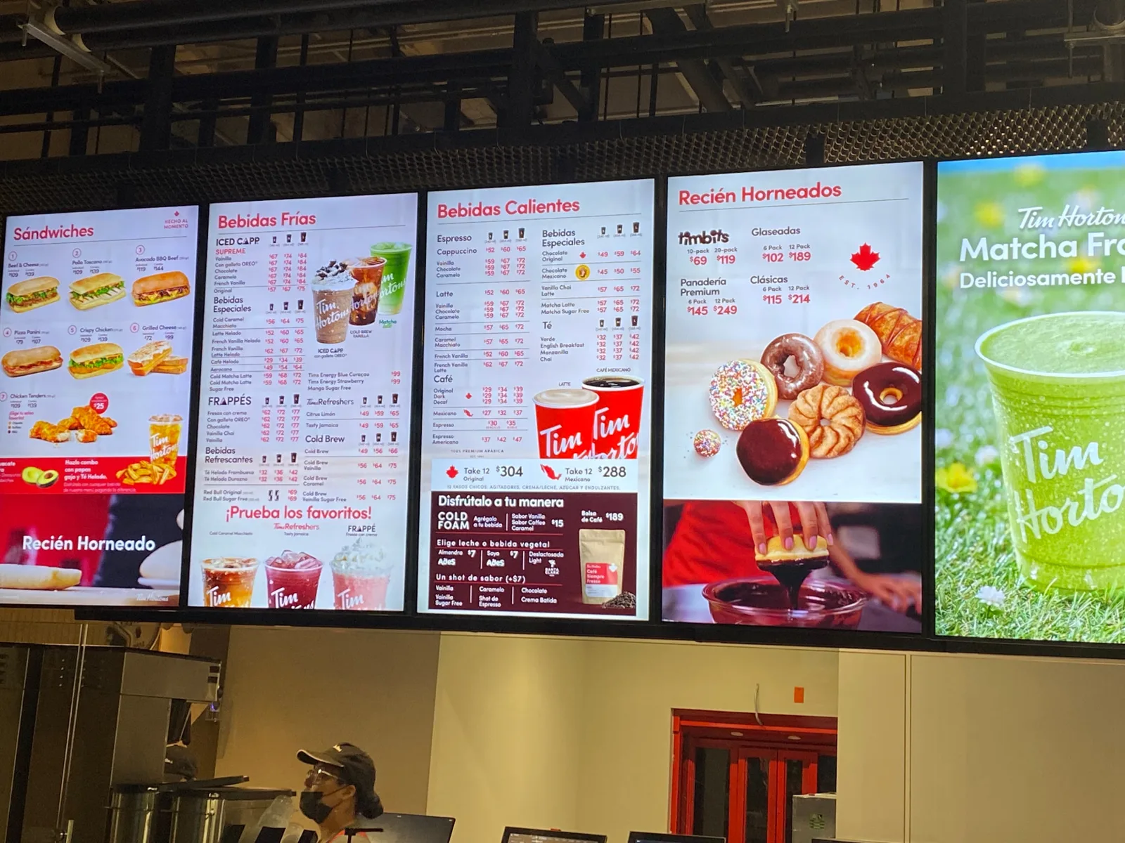 Close-up of Tim Hortons digital menu boards in Mexico showing sandwiches, cold drinks, hot drinks and fresh-baked items