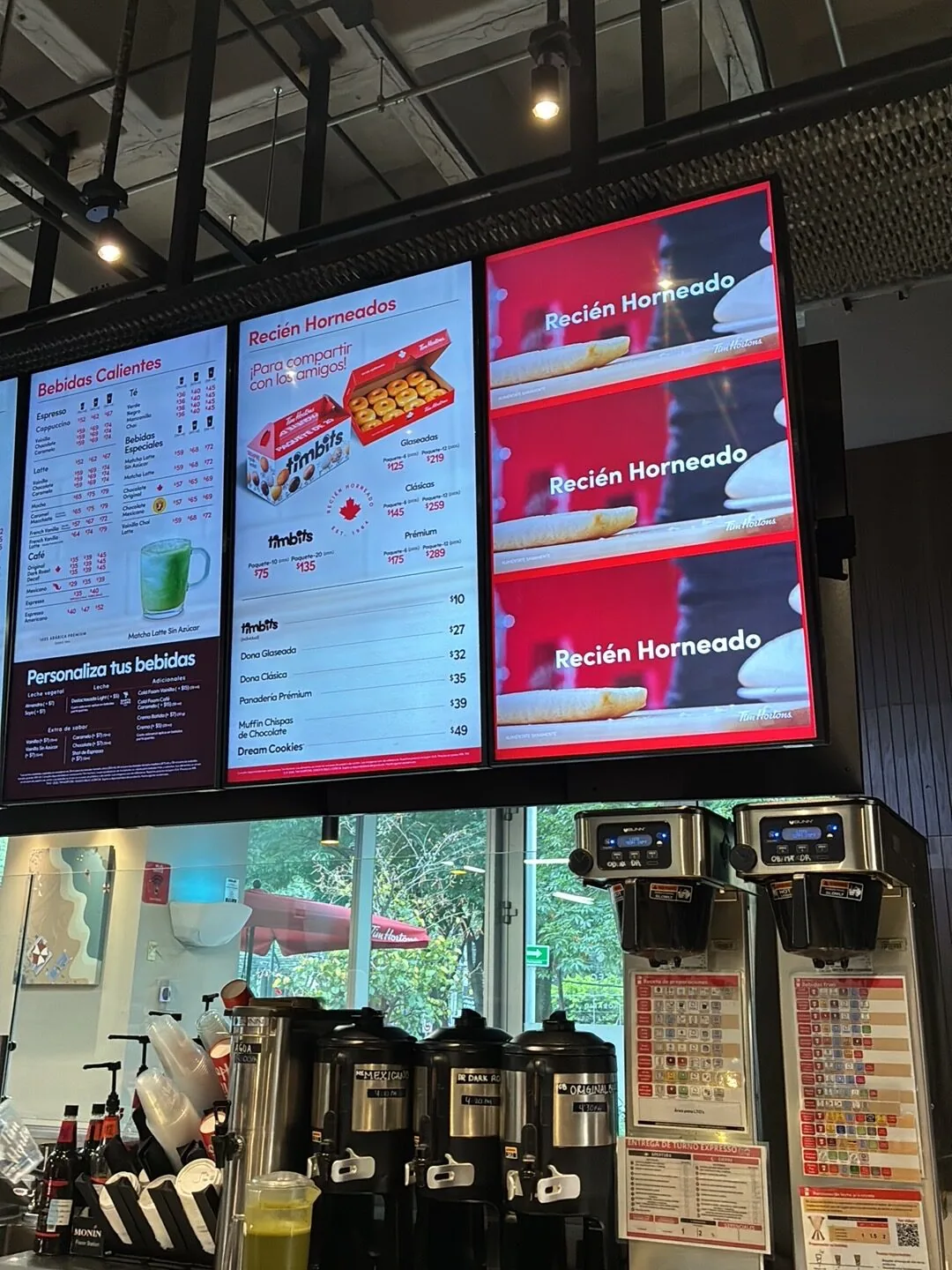 Tim Hortons digital menu boards in Mexico showing a Recien Horneado promotion above beverage dispensers