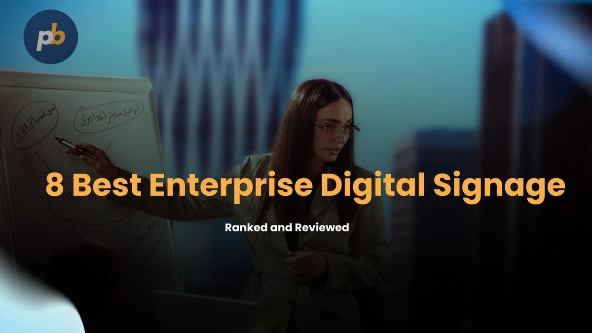 8 Best Enterprise Digital Signage in 2026, ranked and reviewed, with a presenter leading a workplace meeting